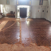 Sanding during the renovations of the block flooring at Cheddar Church.